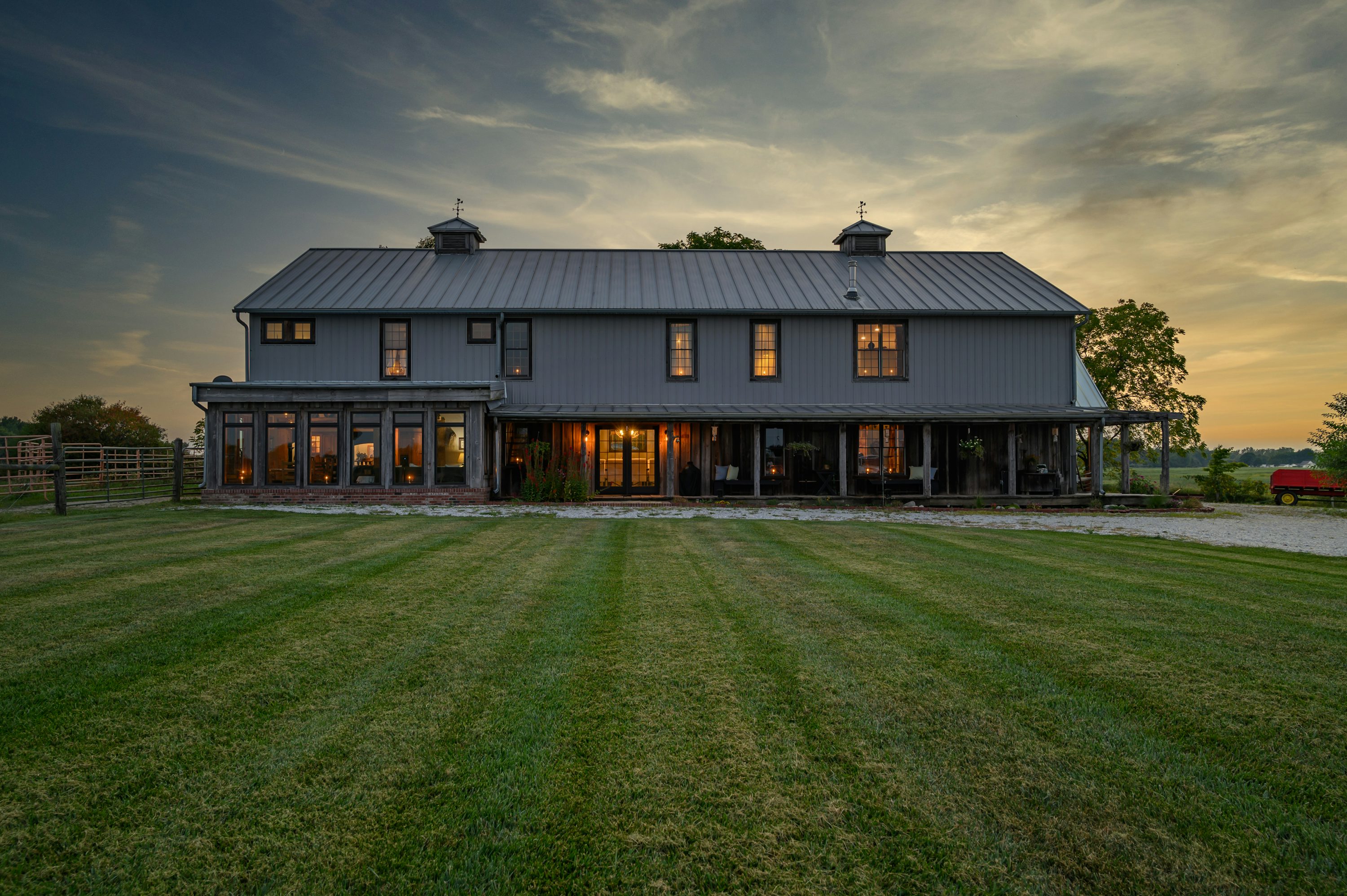 Custom red post-frame pole barn on open Oklahoma acreage